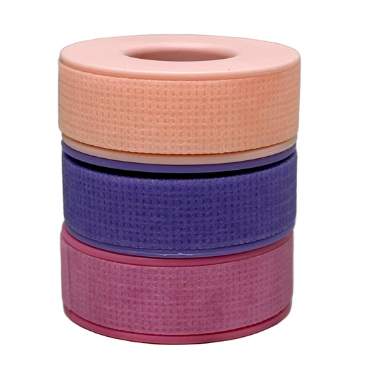 stack of pink purple and light pink tape white background
