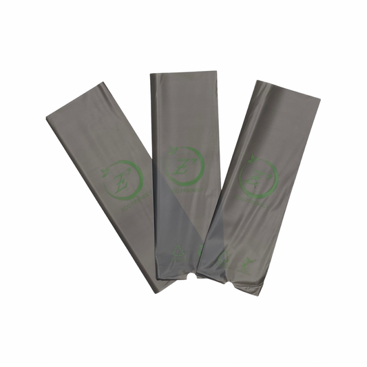3 biodegradable plastic cosmetic tattoo pen machine covers laying flat. Grey in colour.